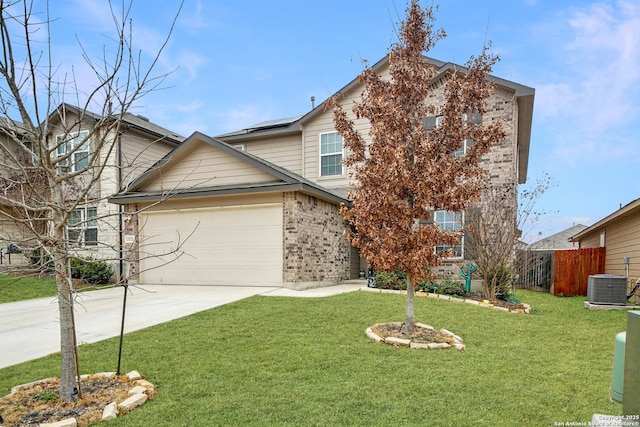 view of front facade with brick siding, a front yard, central AC, a garage, and driveway