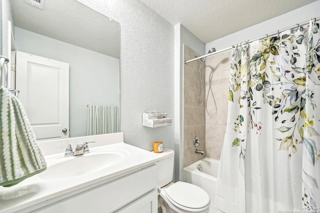 bathroom with a textured ceiling, a textured wall, toilet, shower / tub combo, and vanity