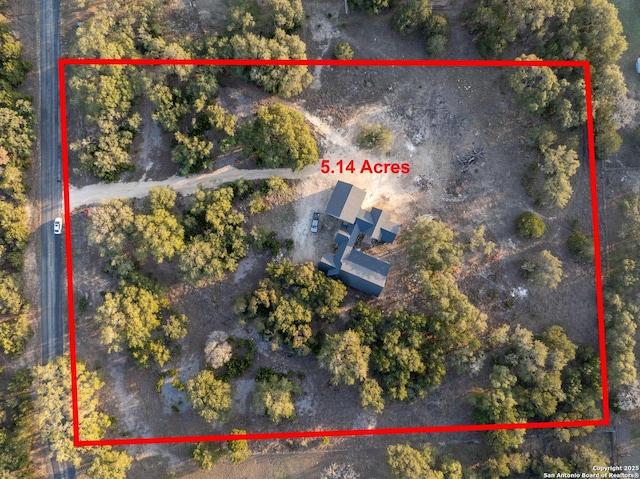 aerial view of property and surrounding area with property parcel outlined