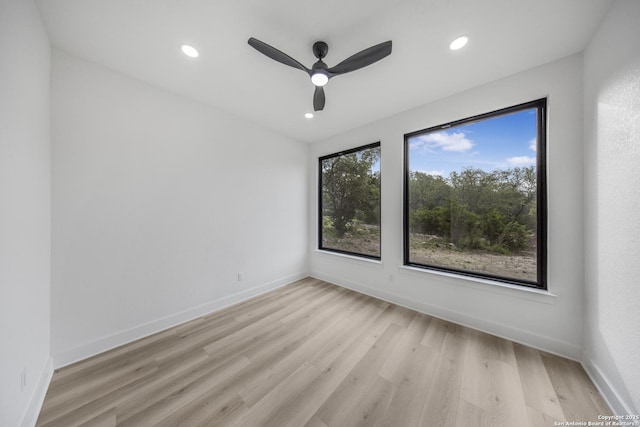 31047 Windmill Ln, Bulverde, TX 78163 - unfurnished room with light wood-style flooring, recessed lighting, a ceiling fan, and baseboards