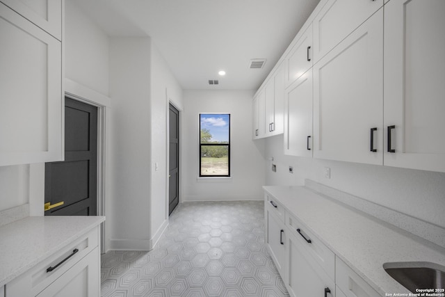 31047 Windmill Ln, Bulverde, TX 78163 - washroom featuring cabinet space, hookup for a washing machine, baseboards, recessed lighting, and electric dryer hookup