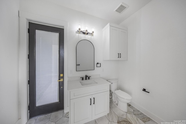 31047 Windmill Ln, Bulverde, TX 78163 - bathroom with vanity, marble finish flooring, toilet, and baseboards