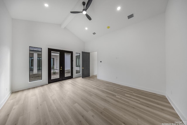 31047 Windmill Ln, Bulverde, TX 78163 - empty room with beamed ceiling, french doors, ceiling fan, light wood finished floors, and baseboards
