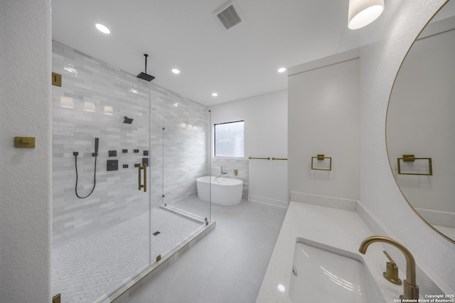31047 Windmill Ln, Bulverde, TX 78163 - bathroom with a sink, a stall shower, a soaking tub, and recessed lighting