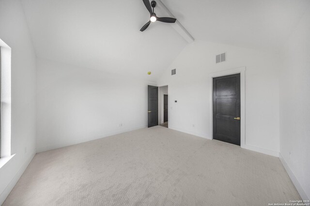 31047 Windmill Ln, Bulverde, TX 78163 - empty room featuring carpet floors, beamed ceiling, a ceiling fan, high vaulted ceiling, and baseboards