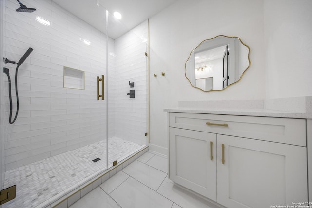 31047 Windmill Ln, Bulverde, TX 78163 - bathroom with a shower stall, vanity, baseboards, and tile patterned floors