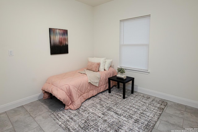 bedroom featuring baseboards