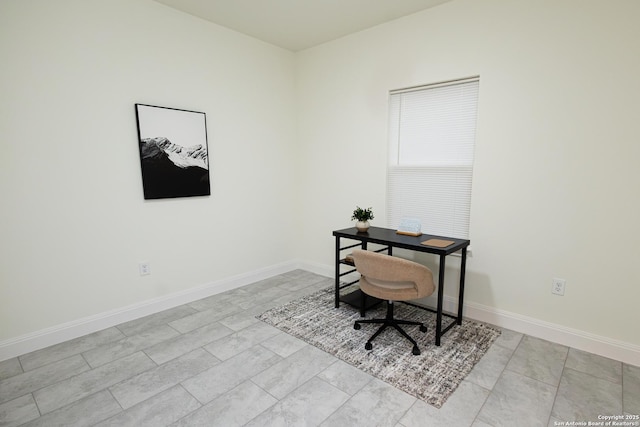 office area featuring baseboards