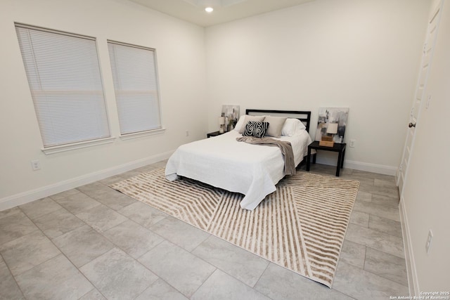 bedroom with recessed lighting and baseboards