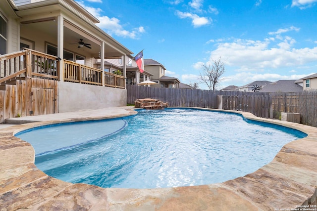 view of pool featuring a fenced backyard, a ceiling fan, and a fenced in pool