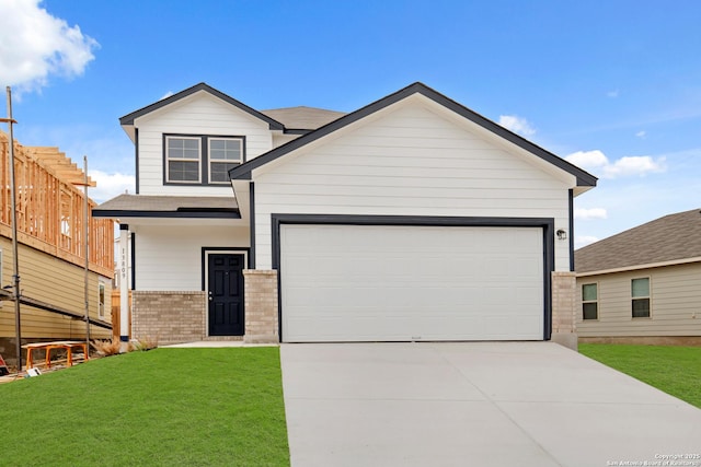 view of front of property with an attached garage, brick siding, driveway, and a front lawn