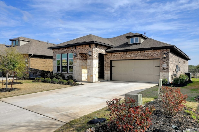 view of front facade with brick siding, roof with shingles, concrete driveway, an attached garage, and a front yard