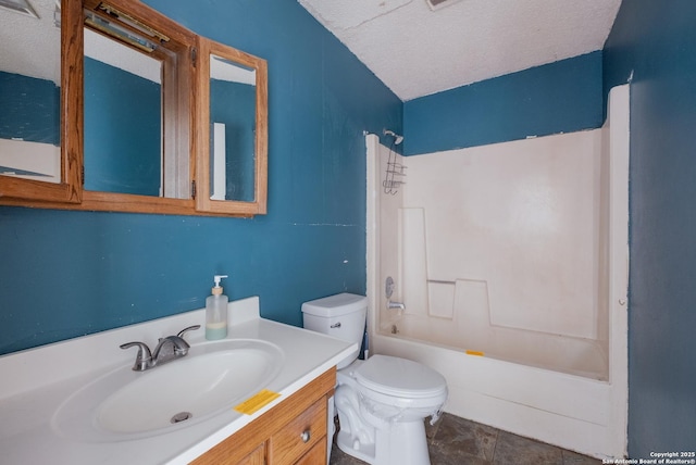 full bath featuring toilet, tub / shower combination, a textured ceiling, and vanity