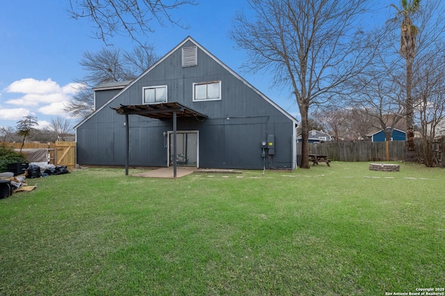 back of property featuring a lawn and a fenced backyard