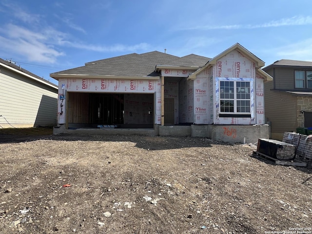 property in mid-construction with an attached garage