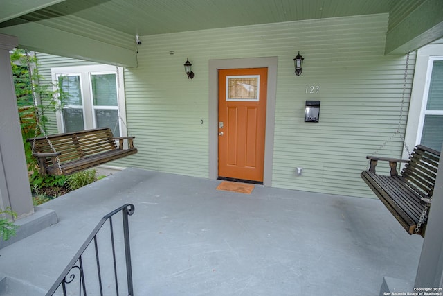 doorway to property with covered porch