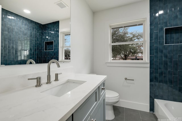 full bath with baseboards, visible vents, toilet, tile patterned floors, and vanity