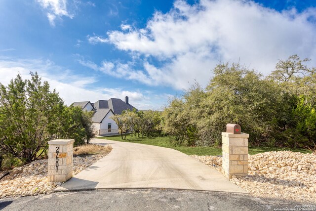 view of road with driveway