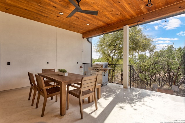 view of patio with ceiling fan, area for grilling, and outdoor dining space