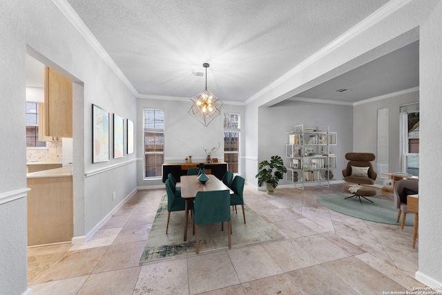 dining room with crown molding, a textured ceiling, baseboards, and an inviting chandelier