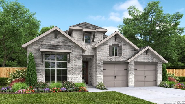 view of front of house featuring driveway, stone siding, fence, and brick siding