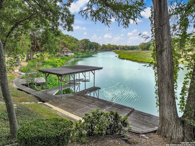 dock area with a water view