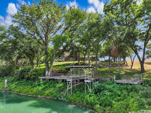 surrounding community featuring a water view