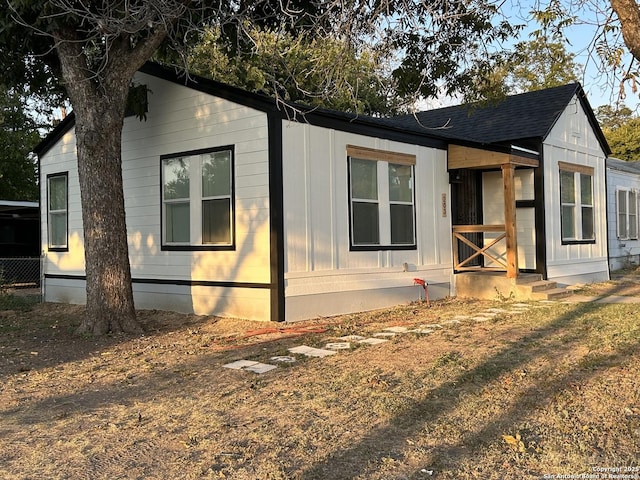 view of front of property with roof with shingles