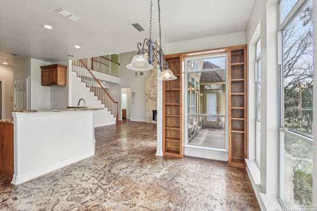 unfurnished dining area featuring stairway, recessed lighting, visible vents, and a healthy amount of sunlight