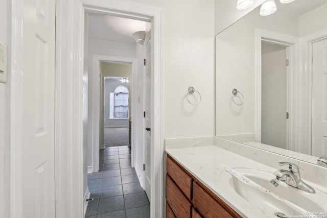 bathroom featuring tile patterned flooring and vanity