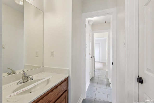 bathroom with tile patterned flooring and vanity