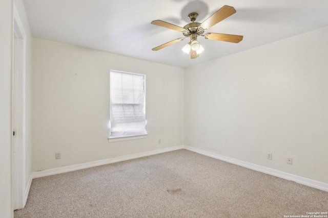 unfurnished room featuring baseboards, a ceiling fan, and light colored carpet