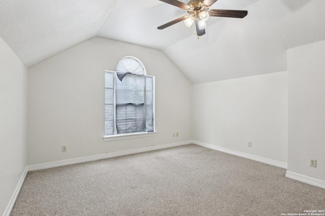 bonus room featuring carpet floors, baseboards, vaulted ceiling, and a ceiling fan