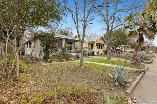 view of front of home featuring fence