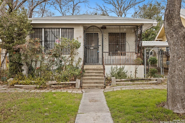 doorway to property featuring a lawn