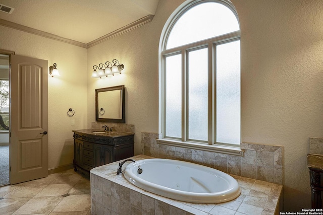 full bathroom featuring plenty of natural light, crown molding, vanity, and a bath