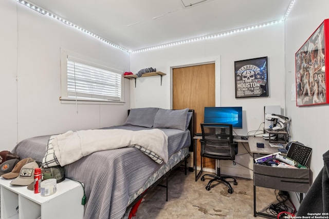 bedroom featuring concrete floors