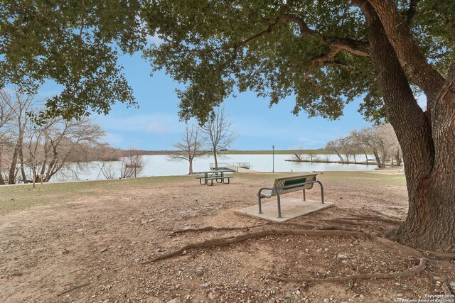 surrounding community with a water view