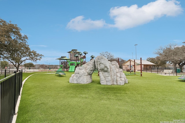 exterior space with playground community and fence