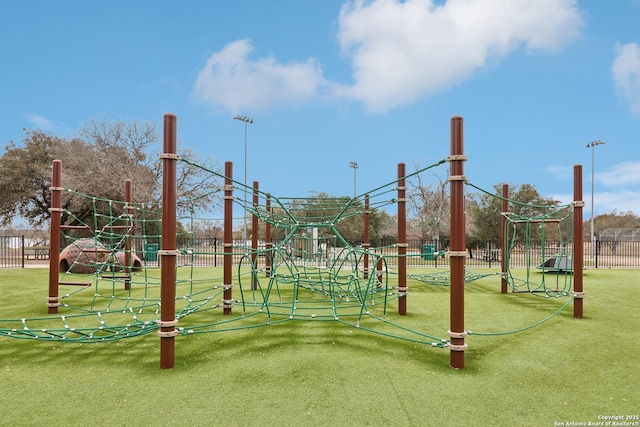 communal playground featuring fence