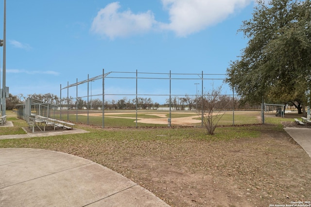 view of home's community featuring a gate, fence, and a yard