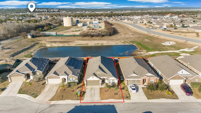 bird's eye view with a water view and a residential view