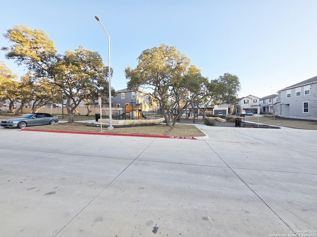 10643 W Military Unit, San Antonio, TX 78251 - view of street with street lighting, a residential view, and curbs