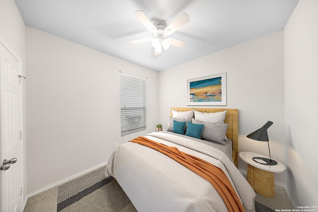 bedroom featuring ceiling fan, carpet floors, visible vents, and baseboards