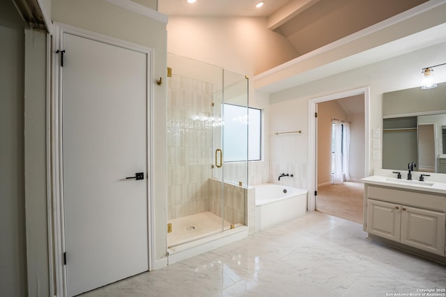 full bathroom featuring lofted ceiling, marble finish floor, a garden tub, vanity, and a shower stall