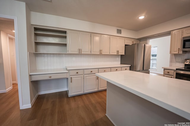 kitchen featuring visible vents, dark wood finished floors, appliances with stainless steel finishes, light countertops, and open shelves