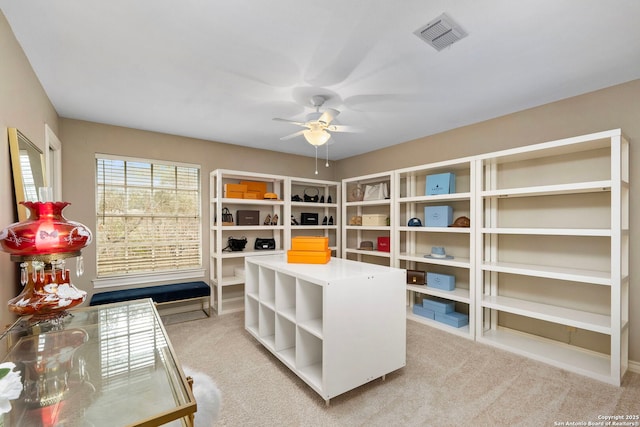 interior space featuring visible vents and ceiling fan