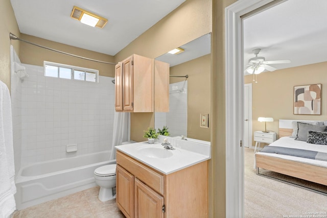 ensuite bathroom featuring visible vents, toilet, shower / bath combo with shower curtain, vanity, and tile patterned flooring