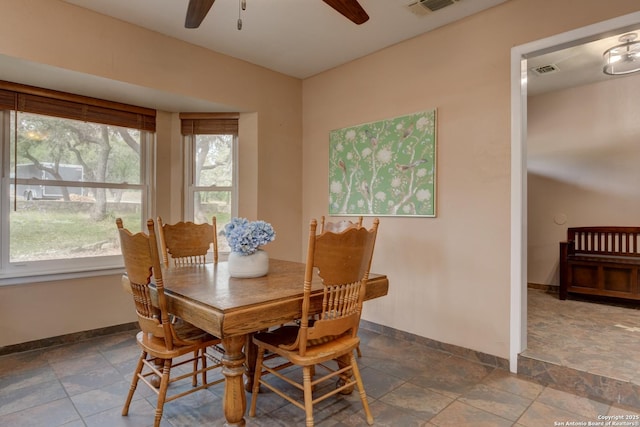 dining area featuring plenty of natural light, visible vents, and baseboards