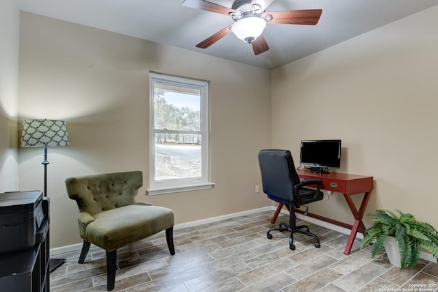 home office with wood tiled floor, baseboards, and a ceiling fan